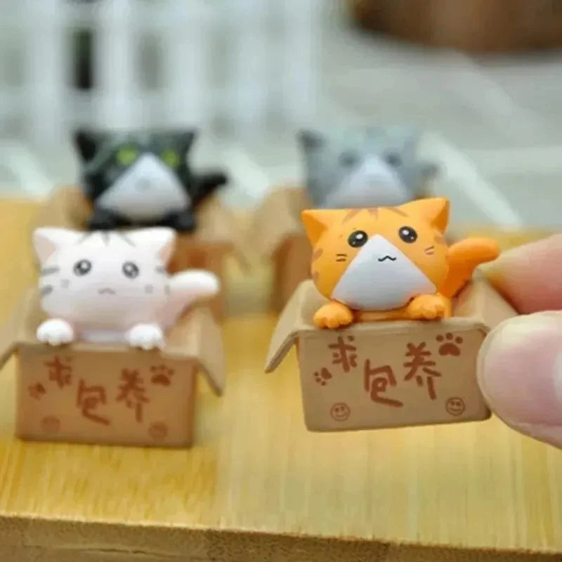 Conjunto de 4miniaturas de gatinhos para decoração .